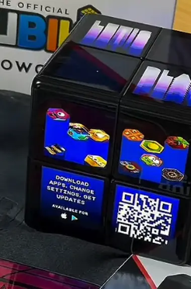 WOWCube on show at an expo stand with a download code
